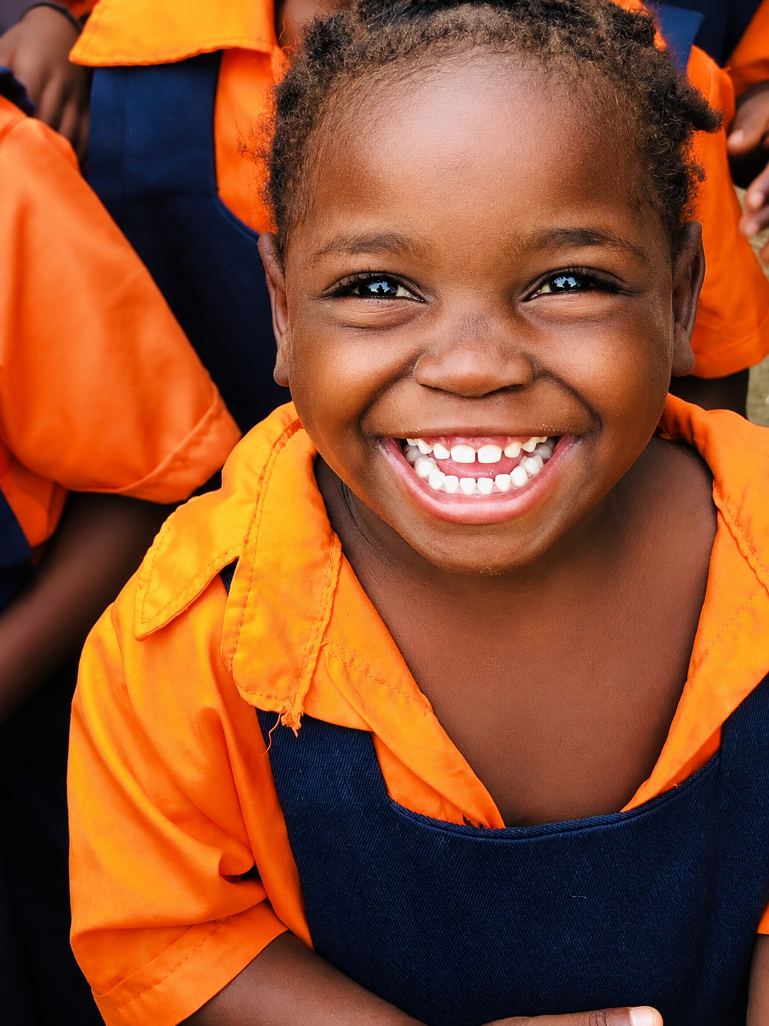 A smiling child attending a Pashello early learning programme